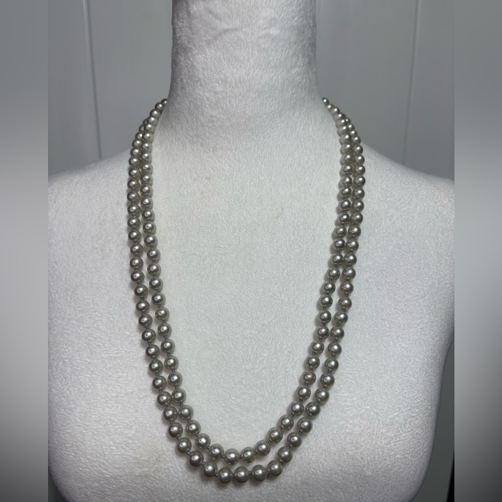 Long strand of grey tinted faux pearls